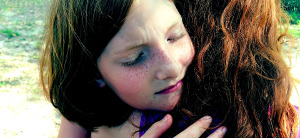 helping kids cope with loss icon girl hugging